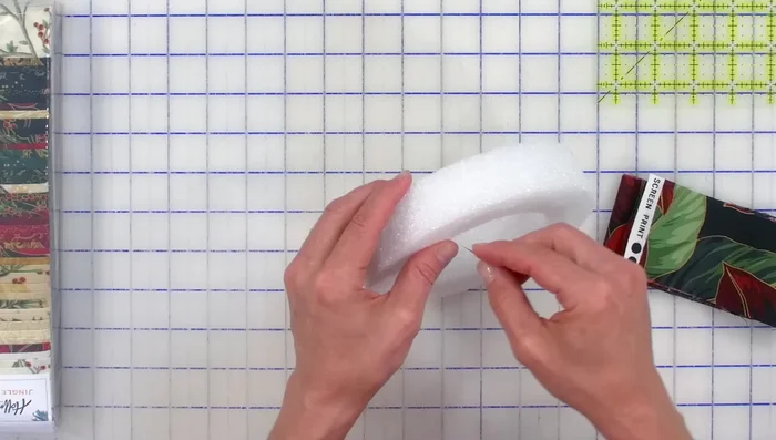 Prepare the Styrofoam Wreath: Stack two 6-inch styrofoam wreaths and secure them with a pin through the center.