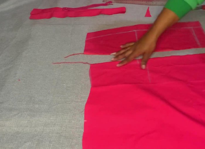 Attach the waist belt (iron if necessary). Sew the zipper and hem the bottom of the skirt.