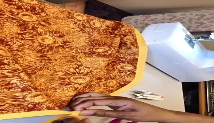 Open, fold bias tape back, and finish stitching.