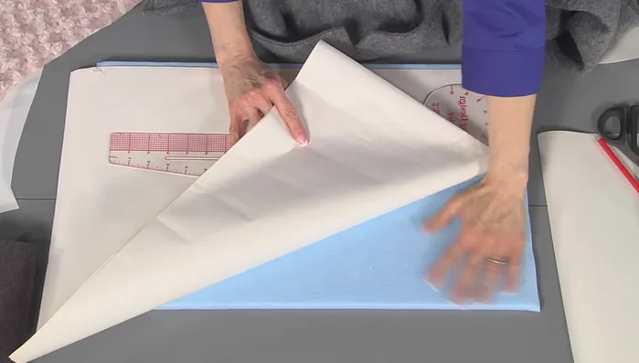 Create multiple pattern drafts until you achieve the desired shape, adjusting for the curve of the neckline.