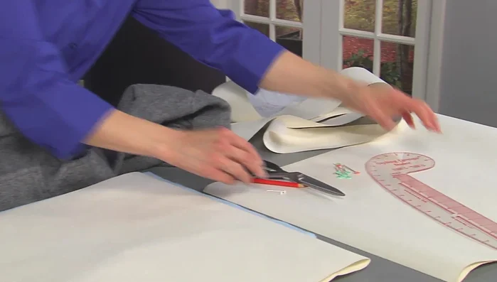 Create multiple pattern drafts until you achieve the desired shape, adjusting for the curve of the neckline.