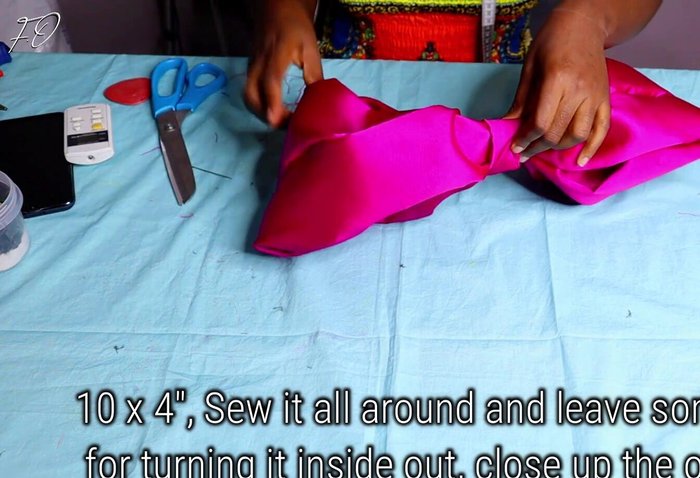 Sew and secure the bow: Secure the fabric covering the bow’s center by sewing it down to the bow.