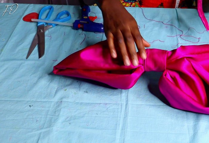 Attach the bow to the headband: Sew the completed bow securely onto the prepared headband.