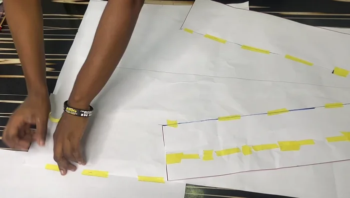 Extend the back pattern by 12 inches at the center back to create a longer back than front. Connect the points smoothly for a curved tail effect.
