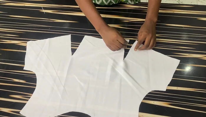 Sew the shoulders using a 0.5-inch seam allowance.