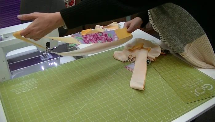 Layout strips: Arrange strips with light color ways on the same side, deciding on quilt layout (e.g., darkest to left, lightest to right).