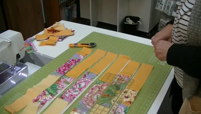 Mark and cut: Mark 3 inches from the focus fabric on the dark side of the first strip. Subsequent strips are marked in 2-inch increments.