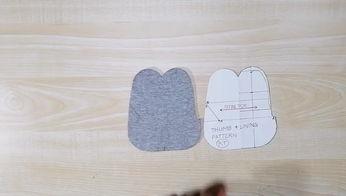 Attach thumb to glove body. Align points B to C and C to D on the thumb piece with corresponding points on the glove body, and sew.