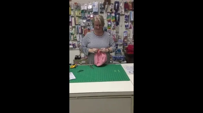 Insert and inflate the balloon: Slide a balloon down into the opening, inflate it, and tie a knot. Tuck in the excess balloon.