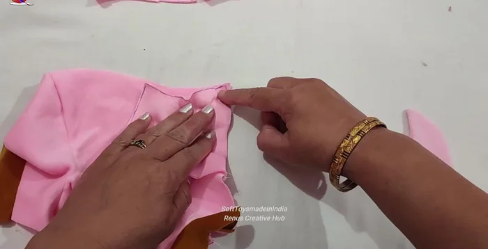 Embroider the nose using straight stitches.