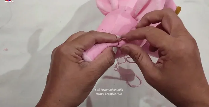 Embroider the nose using straight stitches.