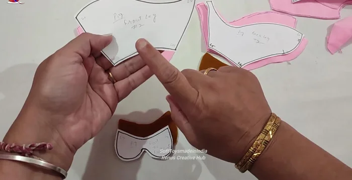 Sew the legs together, folding them at the front.