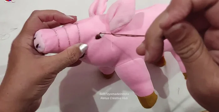 Outline the ice cream details using brown thread back stitch.