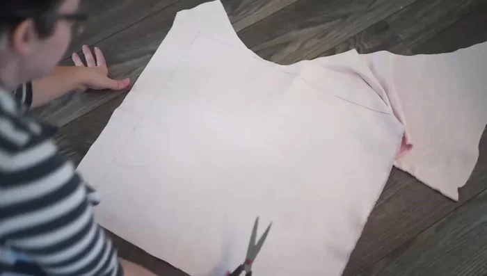 Place the backing fabric pieces right sides together, with the shorter piece on top. Machine stitch only the first and last couple of inches (using a 1/2 inch seam allowance).