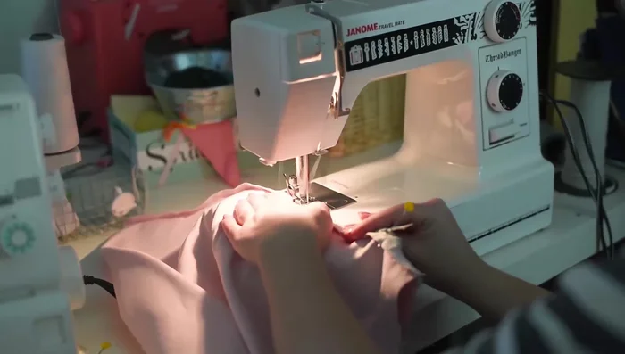 Sew the zipper to both sides of the backing fabric. A zipper foot is helpful but not essential.