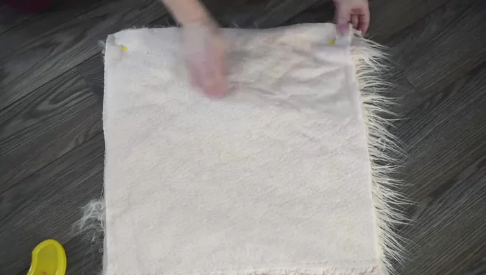 Sew the fur and backing together using a 1/2 inch seam allowance and a longer stitch length (to ease sewing through the thick fabric).