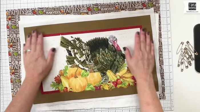 Prepare the placemat materials: Cut out the placemat design from your fabric panel, leaving extra fabric around it. Cut a larger piece of batting and a larger piece of backing fabric.