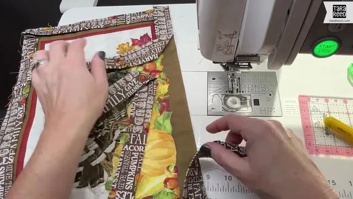 Join the binding ends: Once you've sewn around all four sides, overlap the binding ends. Fold the binding, mark the fold lines, and sew them together, creating a clean join.