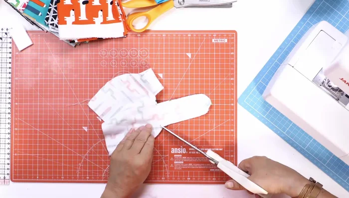 Turn the hat right side out: Carefully turn the sewn hat right side out.