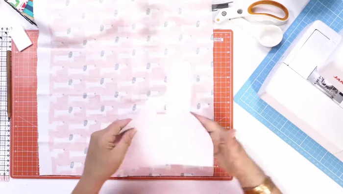 Prepare the fabric: Lay the cotton jersey face down, place the downloaded template on top, and trace it with a soft pencil.