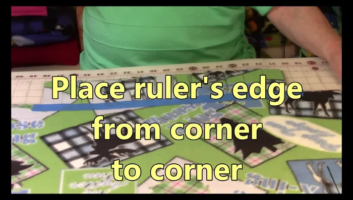 Cut along the taped line to create fringe strips (1.25-1.5 inches wide). Repeat this process along all four sides.