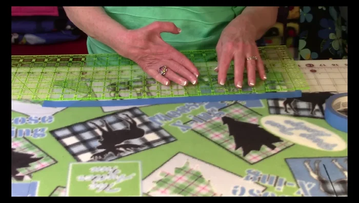 Cut along the taped line to create fringe strips (1.25-1.5 inches wide). Repeat this process along all four sides.