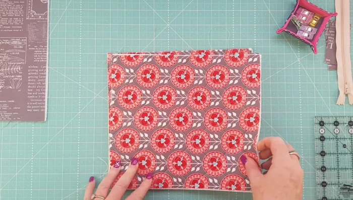 Cut 2-inch squares from each bottom corner of the exterior and lining fabrics to create a flat bottom.