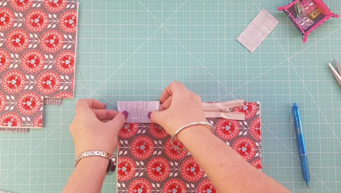 Trim excess zipper tab fabric.