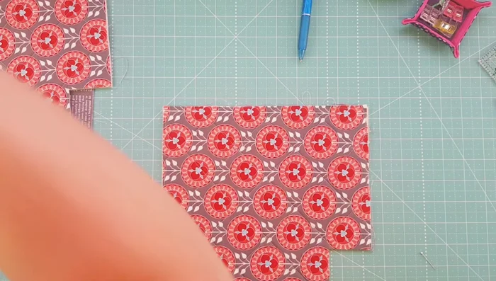 Trim excess zipper tab fabric.