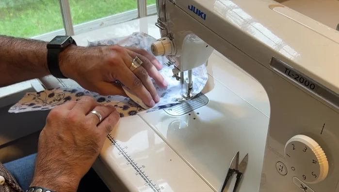 Sew exterior fabric pieces: Sew exterior fabric pieces following the same order as lining, using top stitching for decoration and structure. 