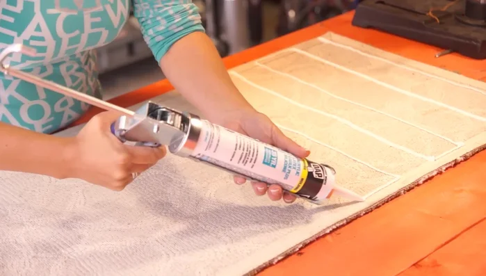 Set the rug aside to allow the caulk to dry completely (at least 24 hours).