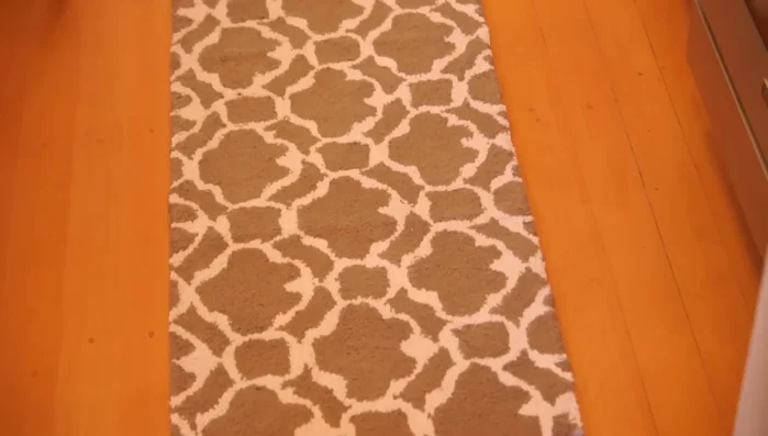 Once the caulk is fully dry, flip the rug back over and place it in its desired location.