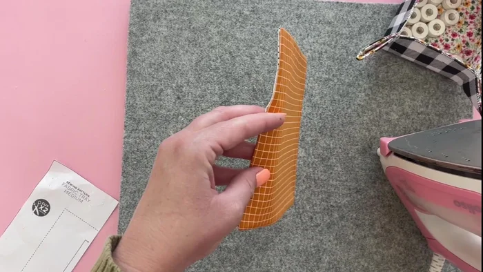 Pin the top edges together, ensuring even alignment. Top stitch around the top edge using a 1/8 inch seam allowance.