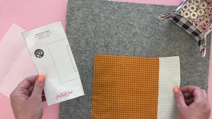 Download and print the template from the website. Cut out the lining and main fabric pieces on the fold. This will create squares that, when opened, will be larger squares.