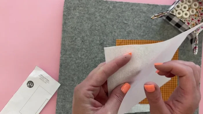 Apply fusible interfacing to one side of the fabrics (either main or lining). If using thicker interfacing, apply it to only one fabric piece.