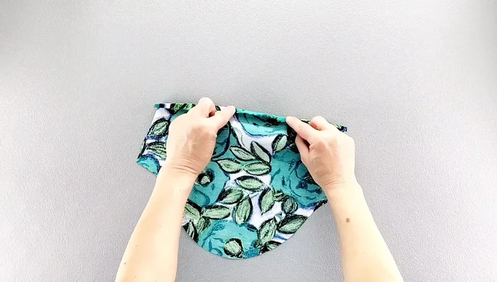 Hem the sleeves: Press the raw edges twice (3/8 inch, then 5/8 inch), sew, and finish raw edges.