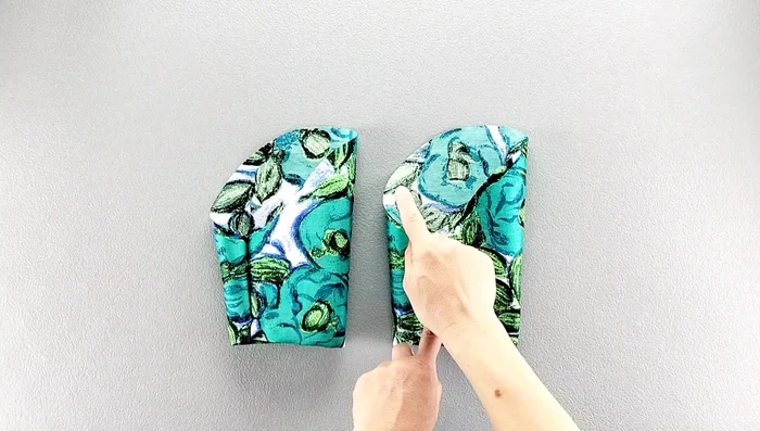 Baste the sleeves with long stitches, ease, pin, and sew into the armholes.