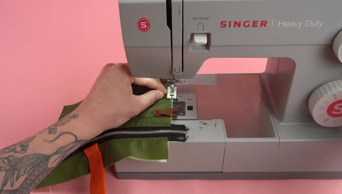 Sew the rings to the panel, one at a time.