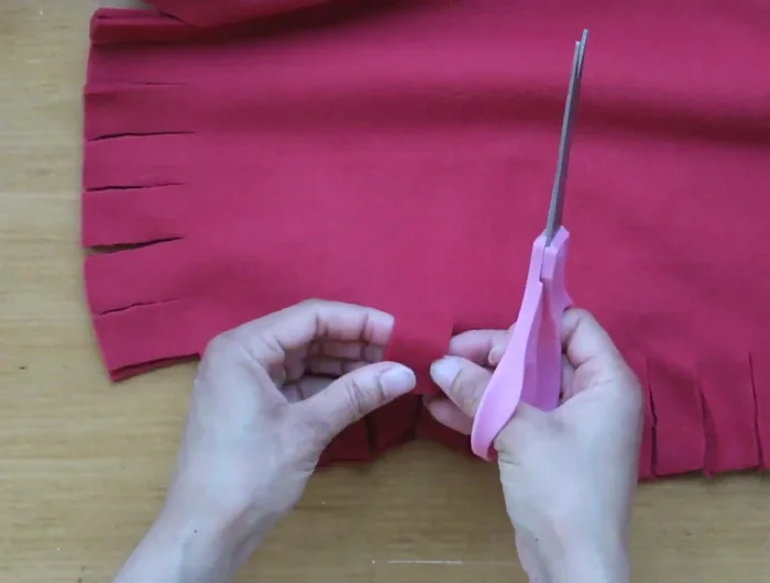 Make a slit through both layers of fabric on each flap.