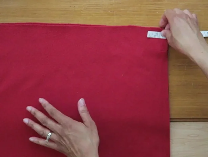On three sides of each fabric square, make 1-inch cuts along the edge, stopping at the 2-inch corner cuts.