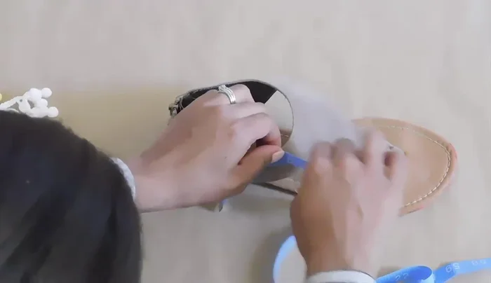 Cut trim, adding extra length to prevent fraying.