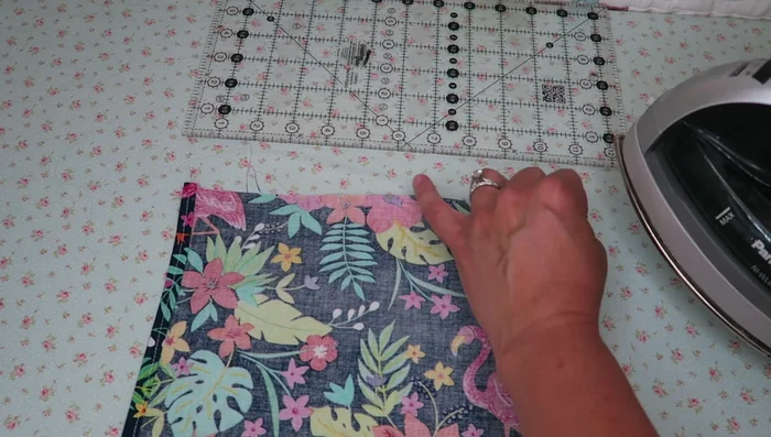 Fold and press the short edges twice (1/4 inch each time).