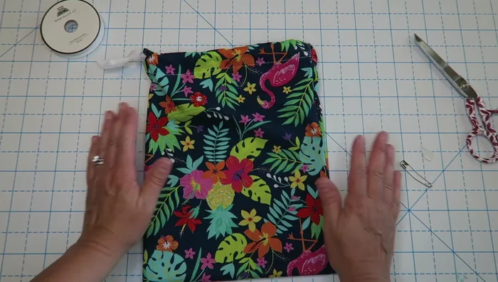 Tie the ends of the drawstring in a knot.