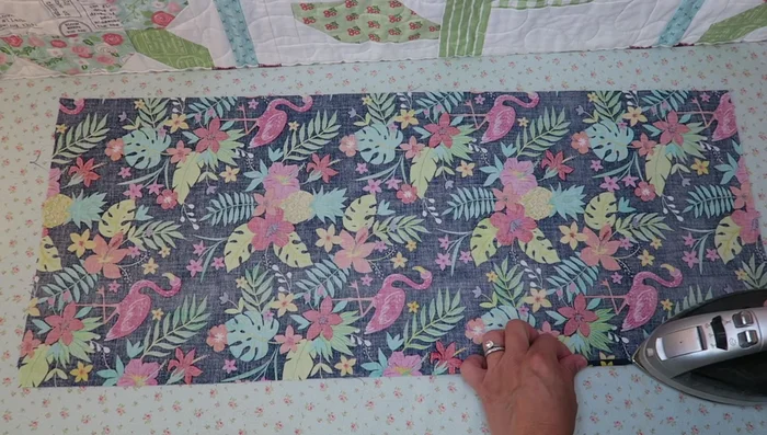 Fold and press the short edges twice (1/4 inch each time).