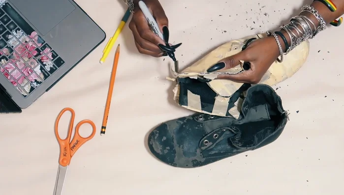 Cut fabric pieces using the pattern, adding seam allowance (though later removed).