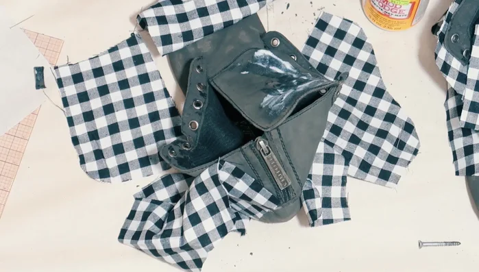 Cut away fabric covering grommets and paint grommet areas black.