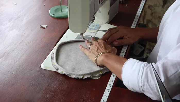 Sew the welt onto the circles using a zipper foot, maintaining a tight stitch close to the cording.