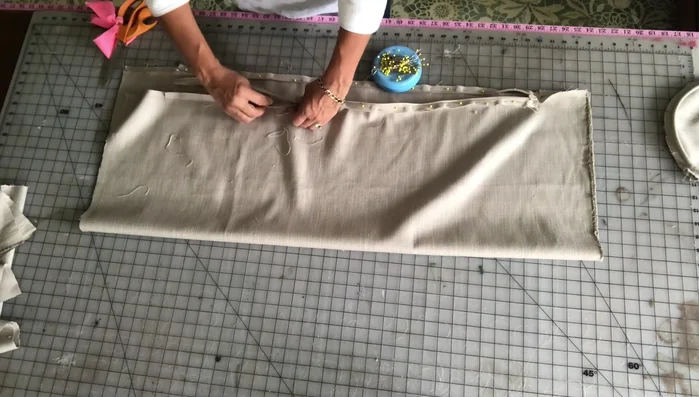 Close the ends of the zipper enclosure: Sew a half-inch seam allowance, backstitching, and then sew a few stitches behind the zipper teeth to secure the enclosure.