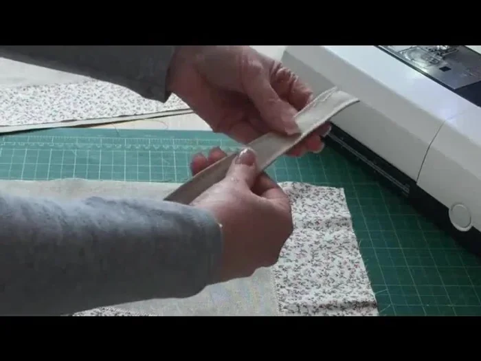 Attach Handles: Position handles 3 inches from the center crease of the main fabric, with the neatly folded side facing upwards. Pin securely in place.