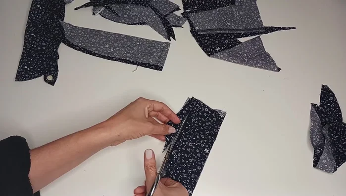 Create a belt from fabric scraps, sewing strips together. Fold, iron, and sew edges to create a finished belt with loops.